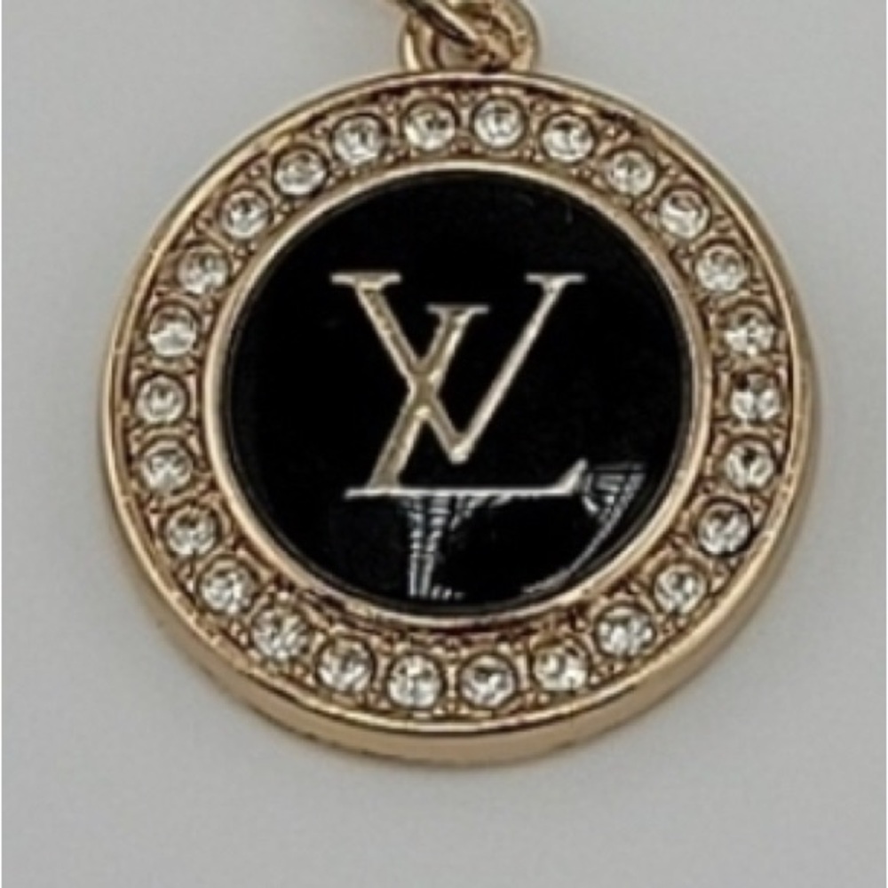 Set: 1. Louis Vuitton Elegant Black and Gold Pendant 2. Bracelet with toggle